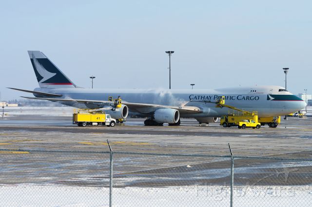 Boeing 747-200 (B-LJF) - De-icing procedure at Toronto (CYYZ) airport.