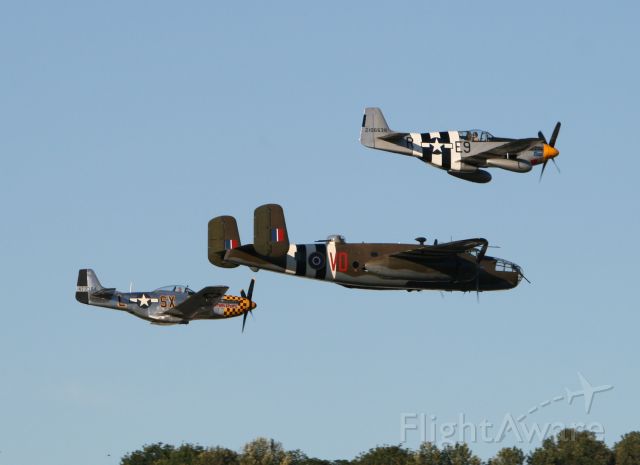 — — - B-25 with two P-51 escorts.  Boeing Field flyover 6-12-10 arranged by the Museum of Flight for their gala hanger dance.
