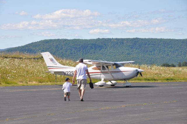 Cessna Skylane (N226SM) - Never too early to start learning.  His logbook begins, pre three years of age. Sole manipulator of the controls - a solid 0.3 over Lake George.  Nice work.  Daddy ATP,CFII, son wide eyed and obviously skilled.