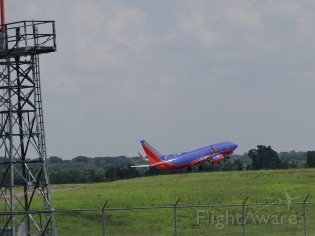 Boeing 737-700 (N435WN) - Standing just south of runway 02C, I was able to capture several aircraft on take-off