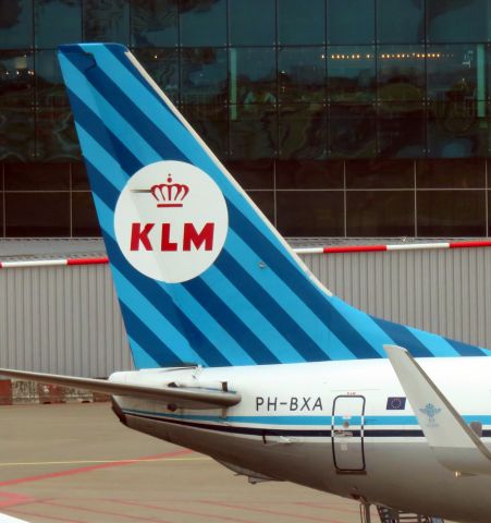 Boeing 737-700 (PH-BXA) - Tail of PH-BXA, Commemorating 95 years KLM: Boeing 737 in nostalgic company color house style design at Schiphol Airport, Amsterdam.