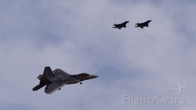 Lockheed F-22 Raptor — - F22 turning final with two F15Es in the overhead.  