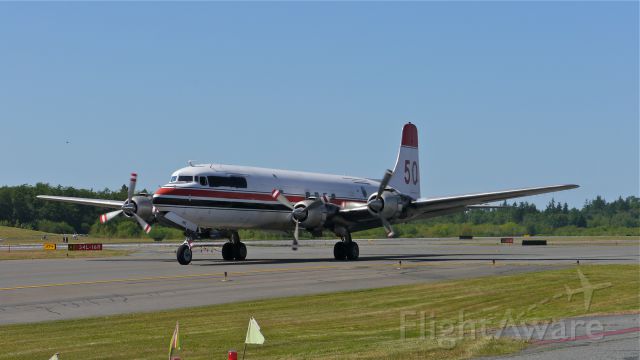 Douglas DC-6 (N501XP) - N501XP a DC-6B (Ser#45177) on Taxiway A prior to departing for PAFA / FAI on 6/6/14. This aircraft is an ex-CONAIR water bomber #C-GKUG. Thanks to member moonm for his research.  a rel=nofollow href=http://www.conair.ca/galleryhttp://www.conair.ca/gallery/a