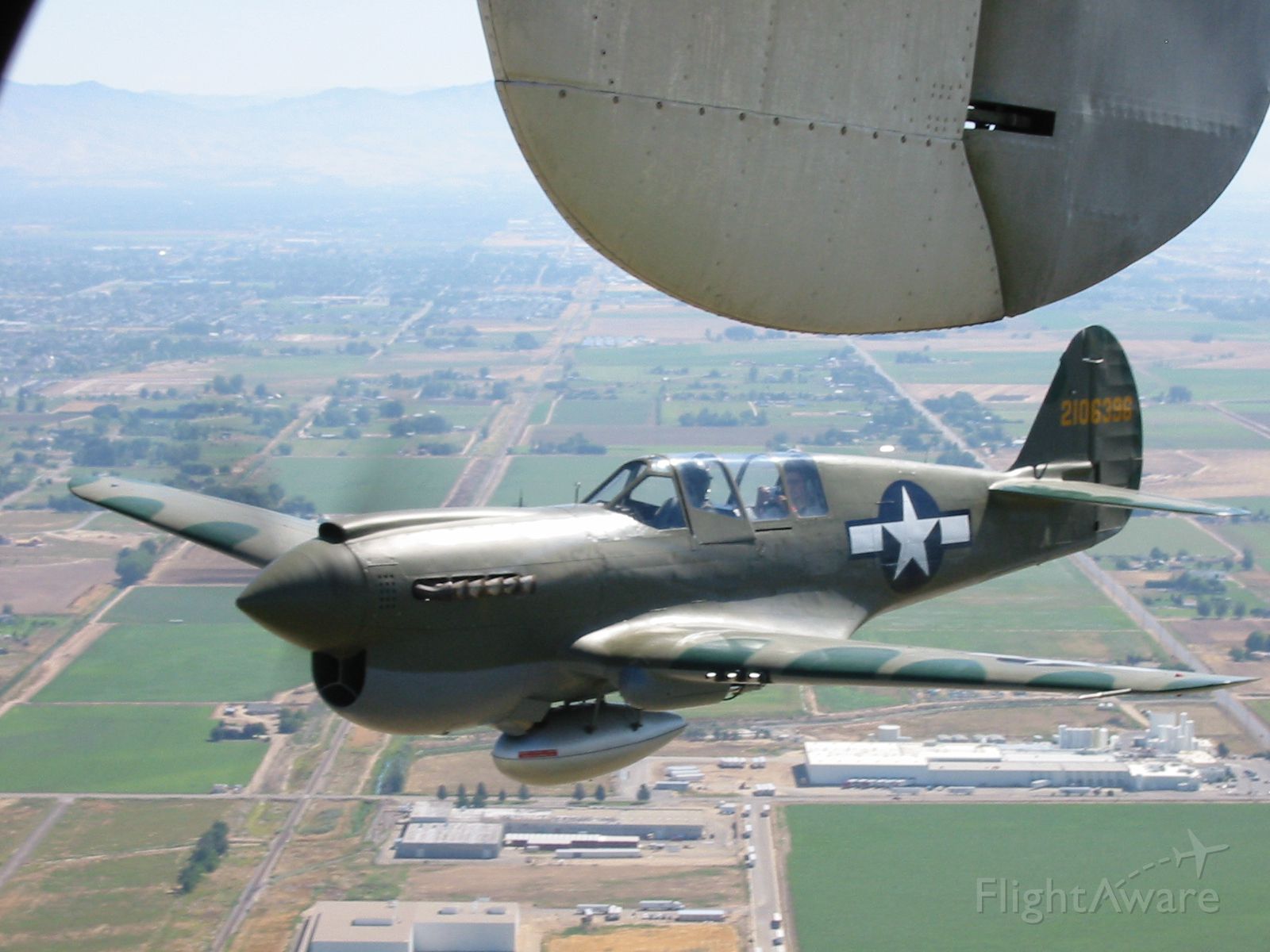 CURTISS Warhawk (N1195N) - My dad got to go up in a B-25, and he was joined by a P-40.  This P-40 has a new nose paint with the parrot.