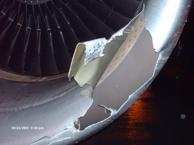 Airbus A319 (N910FR) - Belt loader damage to #2 engine.
