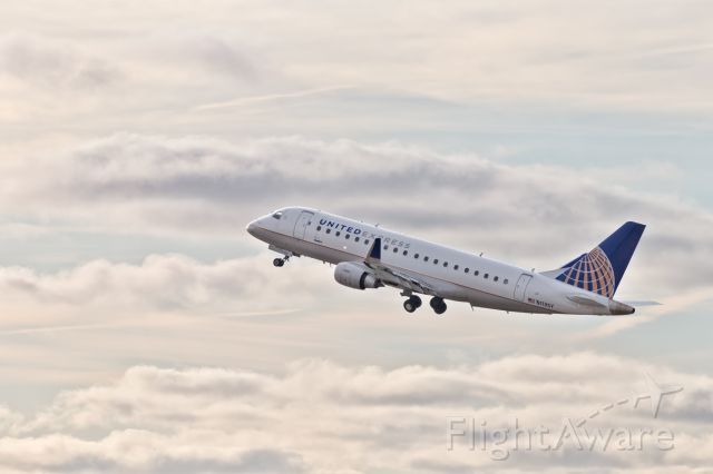 Embraer 170/175 (N113SY) - United Express ERJ-170 on a morning takeoff from 7R at KMKE.