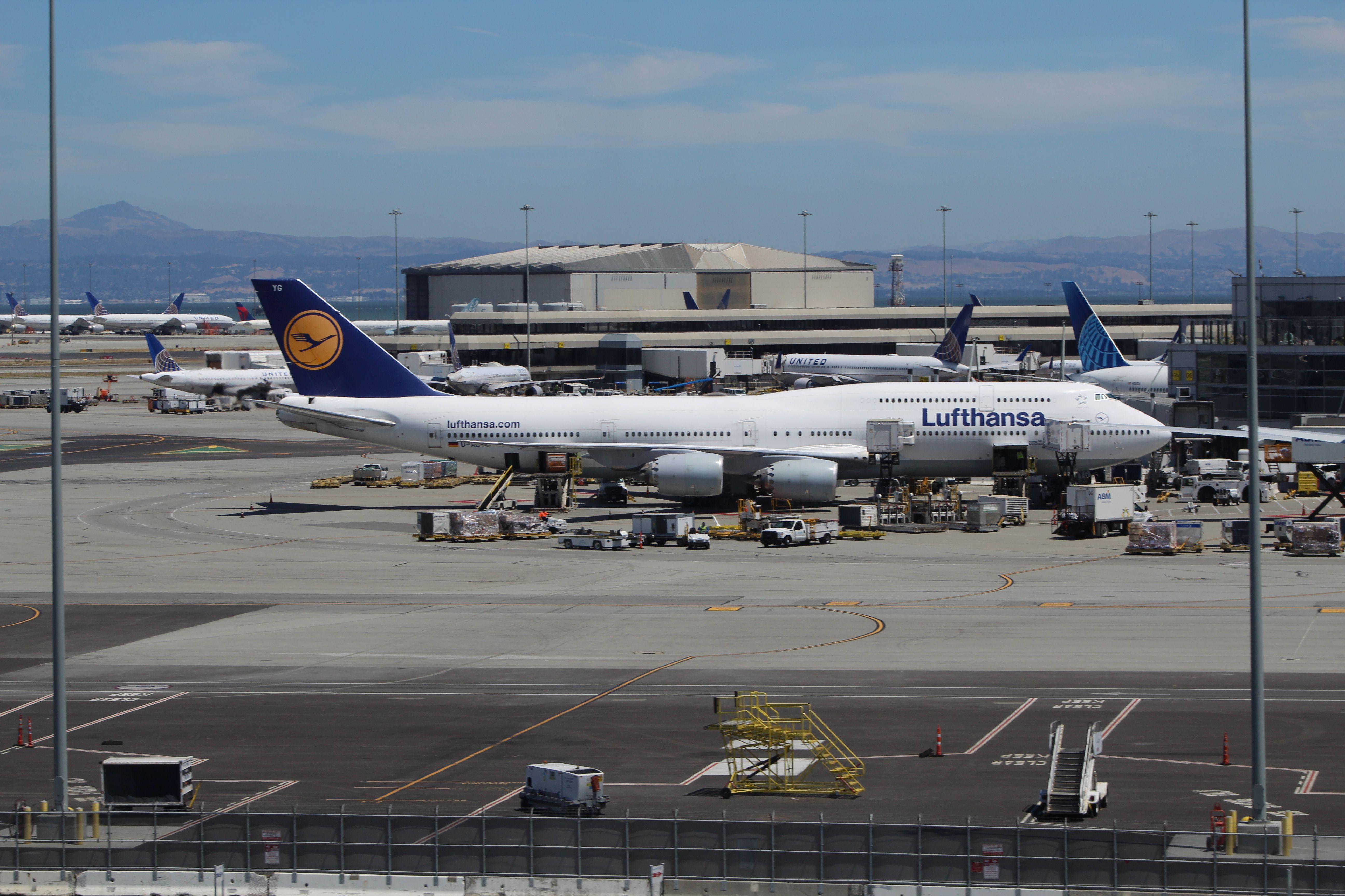 BOEING 747-8 (D-ABYG) - ==View in full for highest quality==br /A Lufthansa 747-830, D-ABYG taken from the San Francisco skytrain. We were moving so there was some motion blur as a tried to not fall over. 