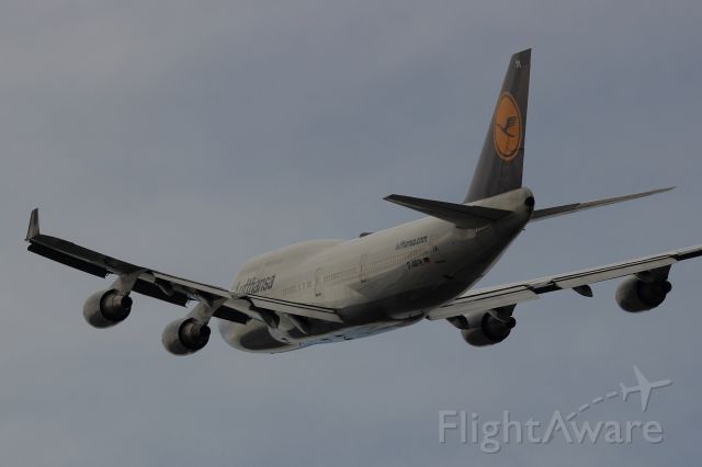 Boeing 747-200 — - This 747 departed runway 33L at Boston.  Taken from the Signature ramp.
