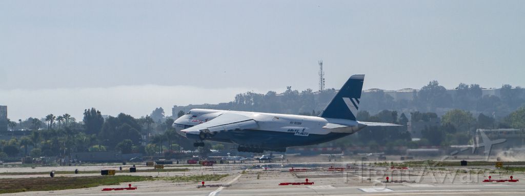 — — - Polet Airlines Antonov An-124 lifts off RY 12 at Long Beach on Feb 21, 2014.  Note the dirt being stirred up on the right side of the photo.