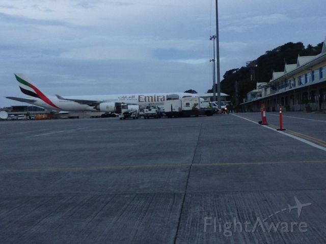 — — - At dusk an Emirates flight, an A340 sits at the International terminal in the Seychelles islands.