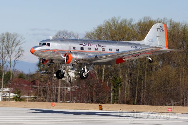 Douglas DC-3 (N17334) - Gorgeous DC-3 Flagship Detroit returns to rwy 19 KGMU after an hour long heritage flight for its foundation members (notice the faces and cameras in the windows!). Sweet old bird!