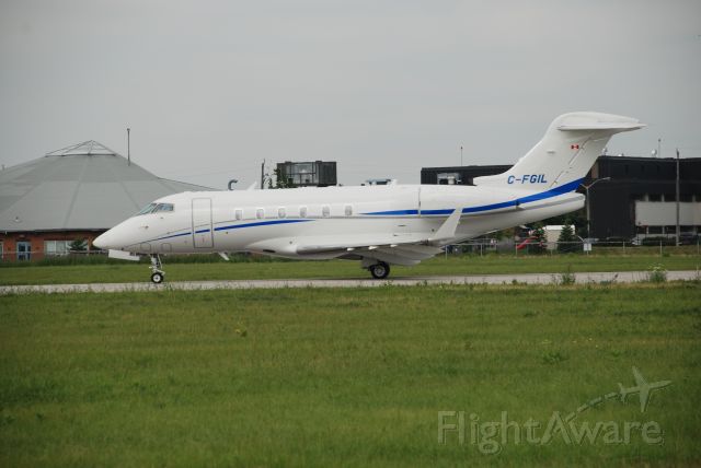 Bombardier Challenger 300 (C-FGIL) - Skyservice Challenger 300 visiting Bombardier plant at Downsview Airport Toronto, July 11/08. Aircraft back tracking to make full use of the runway.