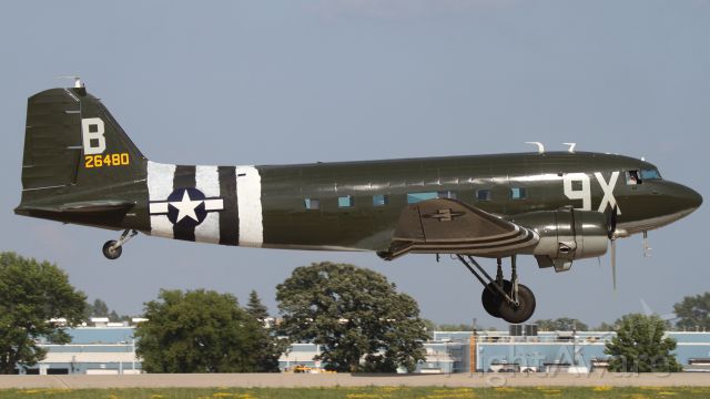 Douglas DC-3 (N534BE) - C-47 returning to the field. Love the hand painted invasion stripes; cool, historic touch.