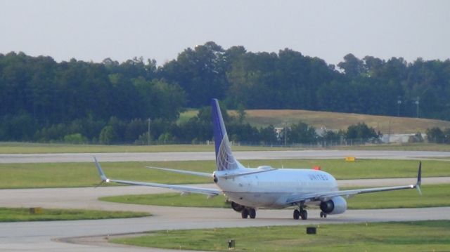 Boeing 737-800 (N76515) - United 1150 departing to Newark at 7 :54 P.M.  Taken June 7, 2015.  