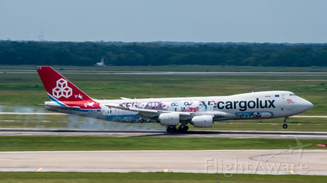 BOEING 747-8 (LX-VCM) - Cargolux's "Cutaway" livery smokes her mains onto RWY08R at IAH on 17 June 2021