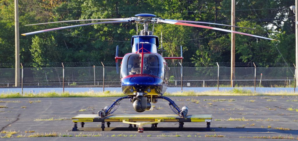 Bell 407 (N77NY) - LINDEN AIRPORT-LINDEN, NEW JERSEY, USA-SEPTEMBER 04, 2018: A helicopter from one of the local New York City T.V. stations is seen on the ground by RF.