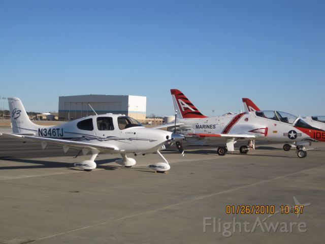 Cirrus SR-22 (N346TJ) - Cirrus SR22 Parked next to a bunch of military trainers.
