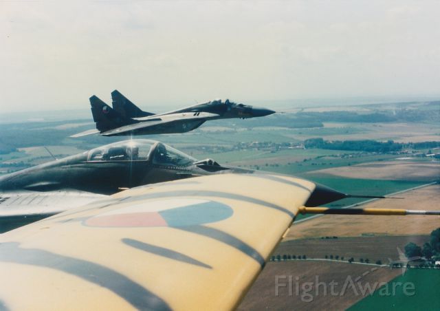 — — - L-29 flying with Mig-29 taken early 90s