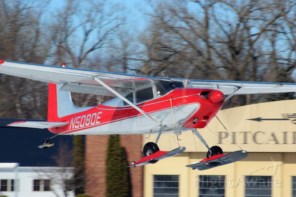 Cessna Skywagon 180 (N5080E) - A colorful Cessna tail dragger leaves the Pioneer Airport on the EAA grounds.