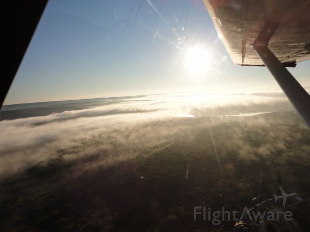 — — - Early Morning departure with fog over Lake Travis.