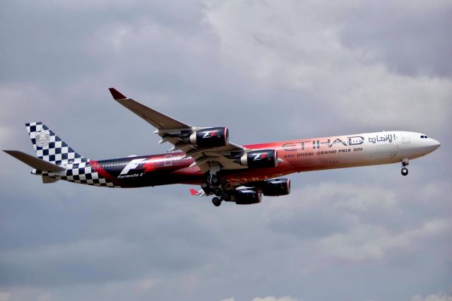 Airbus A340-600 (A6-EHJ) - Etihad A340 with amazing F1 livery on finals while clouds building up
