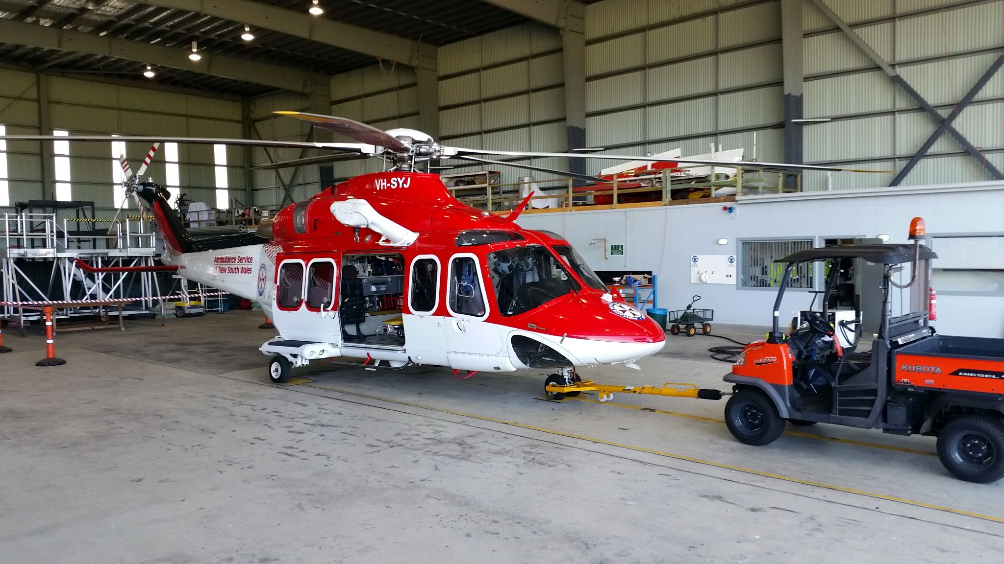 BELL-AGUSTA AB-139 (VH-SYJ) - In the hanger with the tug