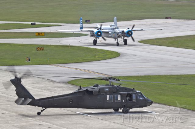 North American TB-25 Mitchell (N125AZ) - Couple of unusual visitors to KMIE this summer! Blackhawk stopped to watch the B25 arrival before they departed