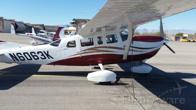 Cessna 206 Stationair (N6063K) - Saw this great looking T206 sitting on the ramp at Henderson Executive. Weeping wing, oversized tires, vortex generators, front passenger door, and tip tanks. Great back country aircraft with about every options available! Very nice!