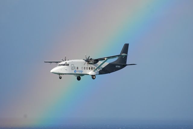 Short SD3-60 (N376AC) - From balcony at Maho Beach in St. Maarten. A beautiful rainbow after a storm.