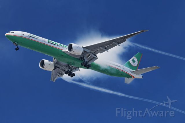BOEING 777-300ER (B-16708) - Pockets of increased humidity seemingly "explodes" as an  EVA Airways operated Boeing 777-300 series widebody jet passes through on final approach to the Los Angeles International Airport, LAX, in Westchester, Los Angeles, California
