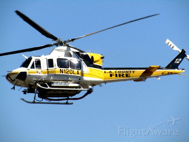 Bell 412 (N120LA) - Lifting off RWY 26R