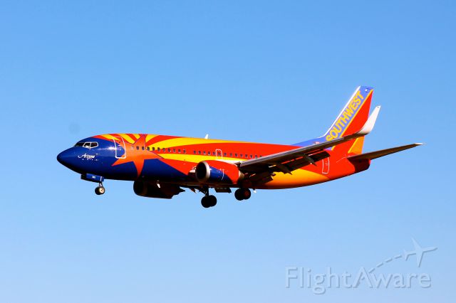 Boeing 737-700 (N383SW) - The "Arizona" from Southwest Airlines seen here landing on 33L at BWI.  This shot was taken from the Thomas Dixon Observation Park along Dorsey Road on January 31, 2012.