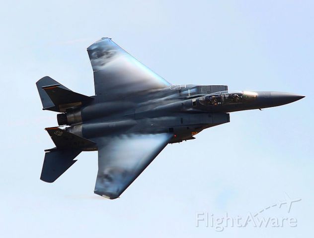 — — - F-15E on a hard bank to the right...