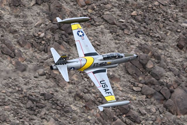 Lockheed T-33 Shooting Star (N133HH) - Flying through Rainbow Canyon, also known as Star War Canyon