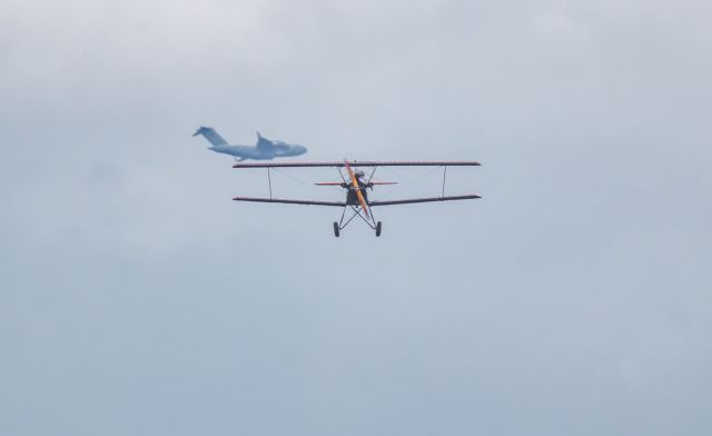 — — - Alumium overcast above a Fleet Model 2 biplane.