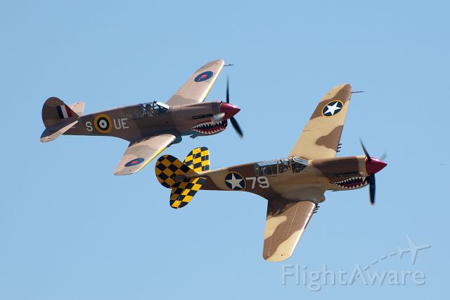 CURTISS Warhawk — - P-40E 79 and P-40E  S UE  perform a high banked fly-by at the 2010 Chino Airshow.