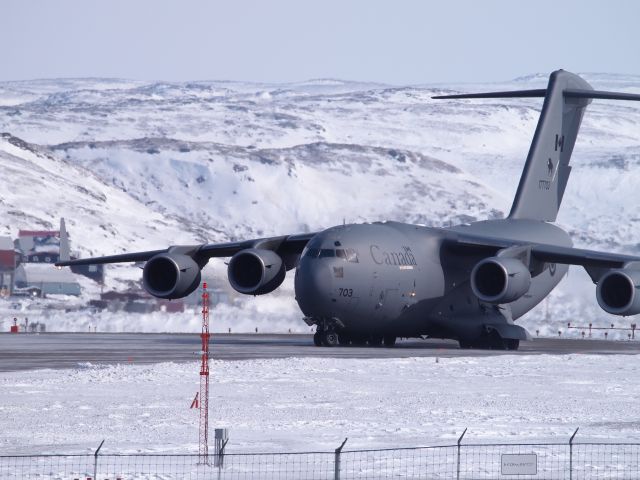 17-7703 — - The Globemaster III leaving Iqaluit airport.