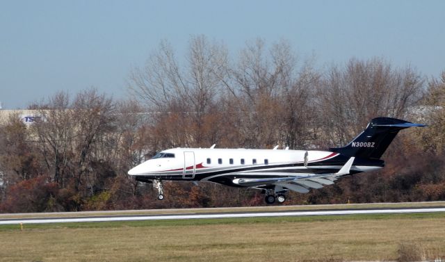 Bombardier Challenger 300 (N300BZ) - About to touch down is this 2011 Bombardier Challenger 300 in the Autumn of 2019.