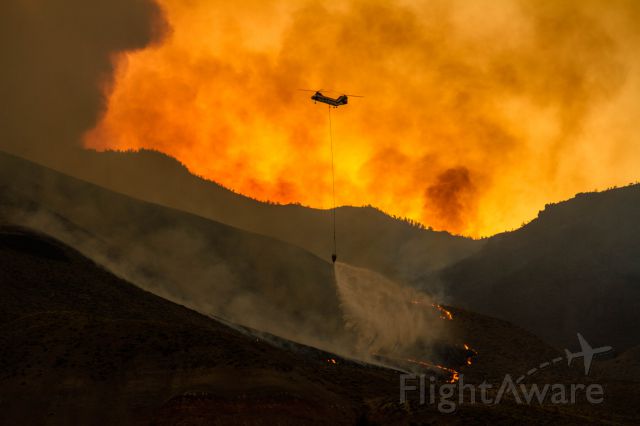 — — - this is a CH 46 sea knight helicopter fighting the Whit Fire.