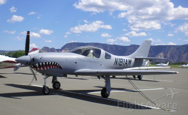Lancair Legacy 2000 (N181AM) - 2012 Lancair Legacy with "Flying Tiger" logo on nose and displayed at Sedona AZ.  Like many Legacies, this one is frequently seen flying over many parts of USA.