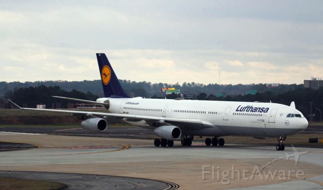 Airbus A340-300 — - A Lufthansa Airbus A340-300 taxis to its gate in Atlanta