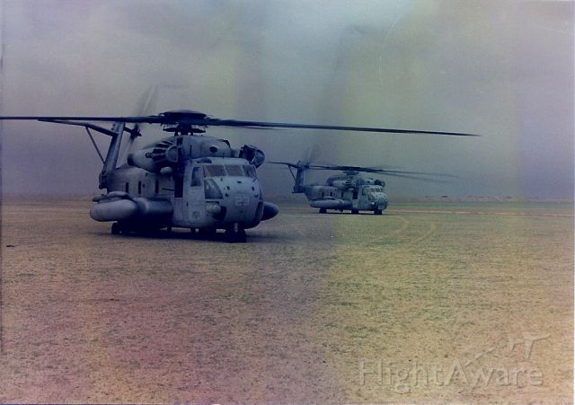 YK66YK64 — - Two CH-53E Helicopters loaded with Marine Infantry staged for an assault from LZ Lonesome Dove into Kuwait on G-Day Operation Desert Storm February 1991