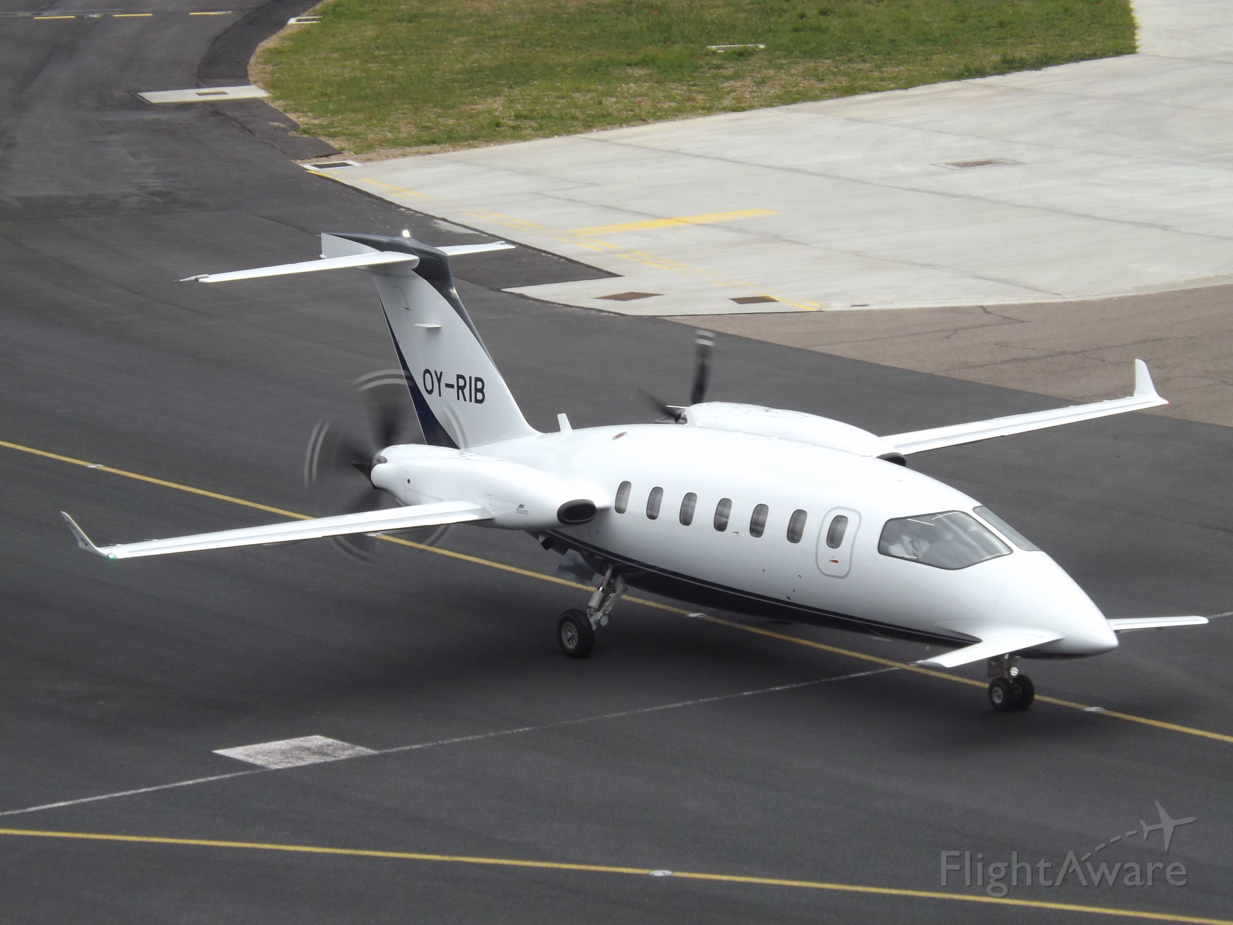 Piaggio P.180 Avanti (OY-RIB) - Taxing in at Luton Airport.