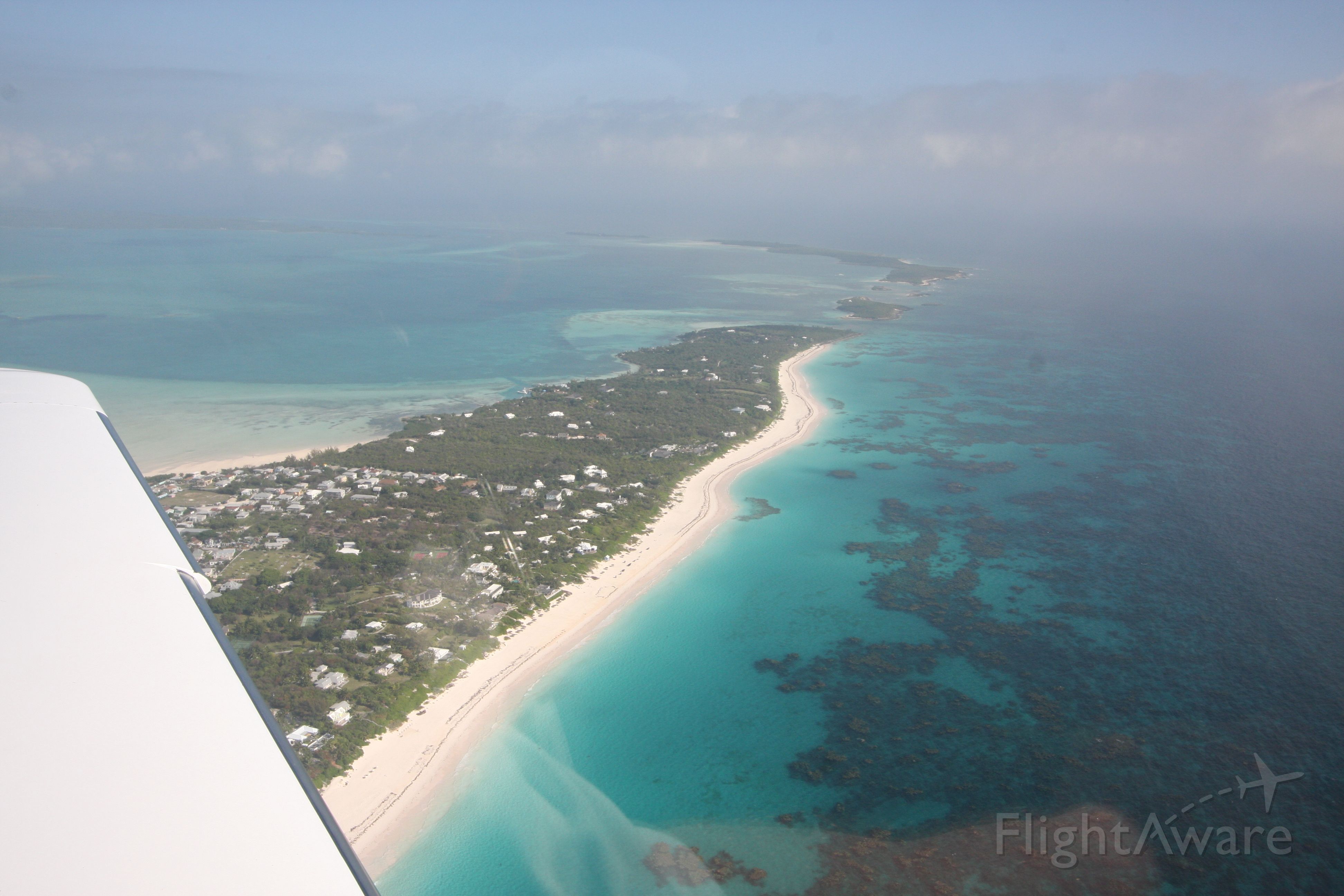Cirrus SR-22 (N229SG) - The Cirrus departing over Harbour Island Bahamas.  The famous pink sands beach is on the right.