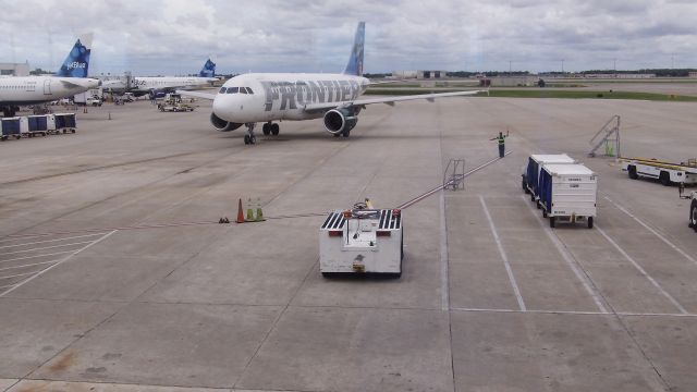 Airbus A319 — - Frontier Airbus A319 at Orlando International Airport (MCO) Gate 10 br /"Pete The Pelican" on Frontier