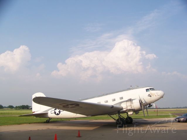 Douglas DC-3 (N151ZE) - The Commemorative Air Force DFW Wings R4D-6S Ready4Duty sitting on the ramp at Lancaster Airport after the 2008 Corsicana Air Show a thunderstorm building to the East overhead.