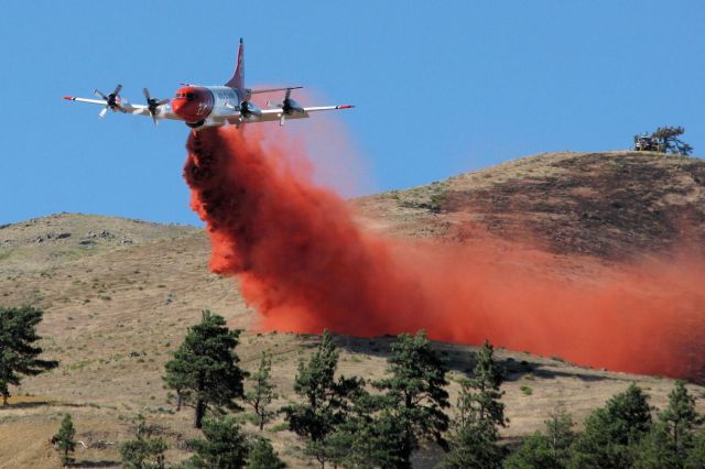 Lockheed P-3 Orion (N923AU) - Aero Unions Tanker 23, a Lockheed P-3A, drops on the "Brooklyn Fire" on the south side of Peavine Mountain around 4:30 PM on July 17, 2011.
