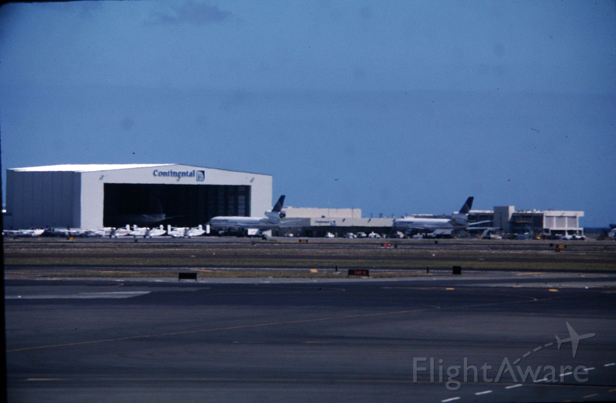 McDonnell Douglas DC-10 — - HNL - Continentals hangar base at Honolulu in this Aug 1998 view.