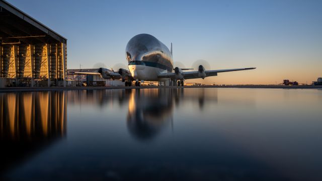 N941NA — - NASA's one of a kind B377SGT Super Guppy runs engines ahead of a night proficiency sortie in December 2022. Taken at about 10" exposure with a ND100 and well-placed puddle on the ramp.