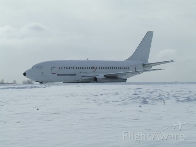UNKNOWN — - unmarked 737 awaiting its fate at a snowy airport